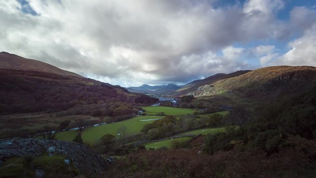 Timelapse of Welsh valley in the Fall with clouds, shadows and sunshine moving towards the camera, Wales