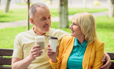 Husband and wife enjoying hot drink together