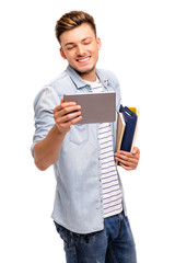 Study on tablet computer. Cheerful young arabic man working on digital tablet. Isolated on white.