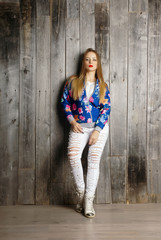 girl wearing blue cardigan.Isolated studio portrait