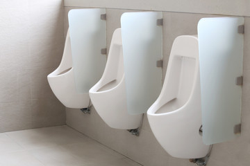 Modern urinal in men bathroom.
