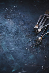 Empty food blue background with Old vintage silverware.