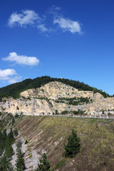 Fototapeta na wymiar stone pit on mountain landscape