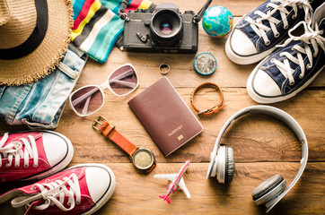 Fototapeta na wymiar Travel accessories on wooden floor ready for travel