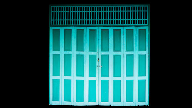 Old Thai door Green Read  in public area Isolated on a black Background.