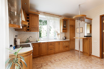 Large kitchen with wooden cupboards