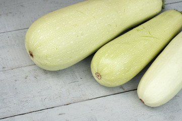 Vegetable marrow on a wooden background