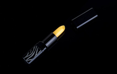 Yellow Lipstick on the black background