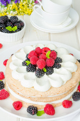 Layer walnut cake with cream and berries