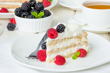 Layer walnut cake with cream and berries