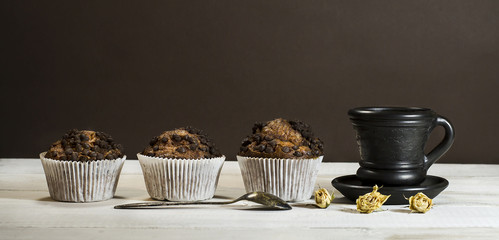 Chocolate cake, a cup of coffee with milk.