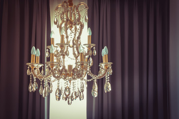 Vintage shining chandelier and curtain