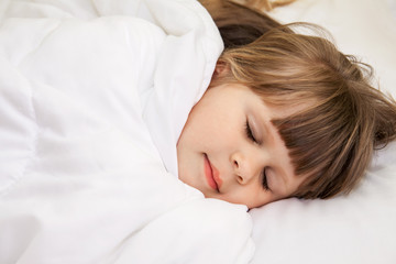 Little girl sleep in bed