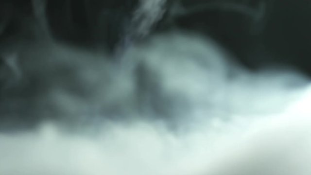 3 in 1! The stream of thick smoke against the background of bright light. Slow motion