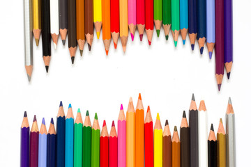 Row of color pencil on white background
