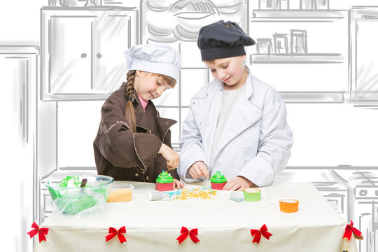 Children making christmas cupcakes