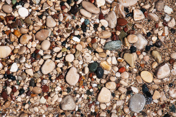 stones on beach and sea water