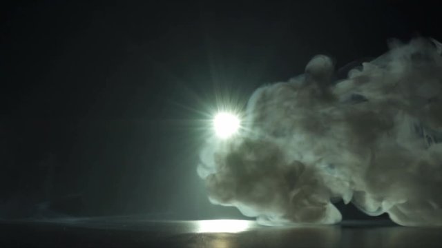 The moolight on the background of thick smoke. Slow motion capture