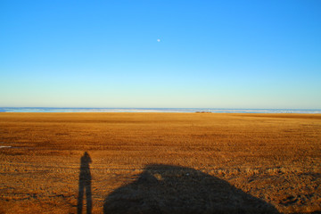 Shadow of a tourist in northern Prince Edward Island