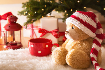 Bear with Christmas gift boxes at night