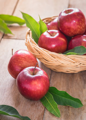 Red apples on wooden table