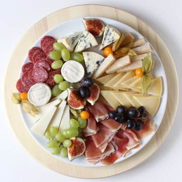 Cheese platte with ham and fruits