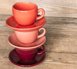 set of colorful cups and dishes and dessert