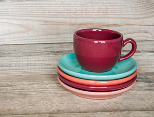 Fototapeta na wymiar set of colorful cups and dishes and dessert