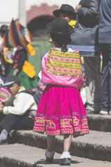 Native people from peruvian city dressed in colorful clothing. Peru, South America.