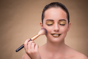 Woman during cosmetics session in fashion concept