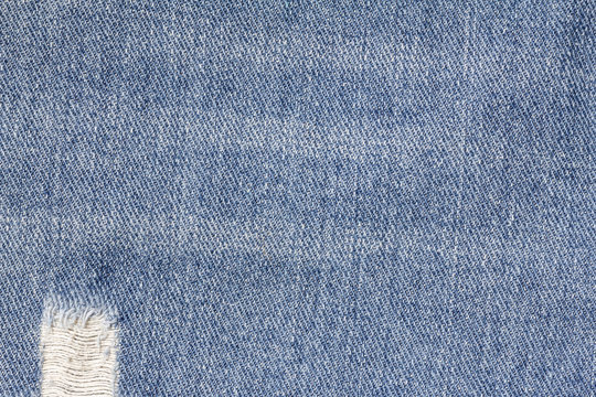 Denim jeans texture or denim jeans background with old torn. Old grunge vintage denim jeans. Stitched texture denim jeans background of fashion jeans design.