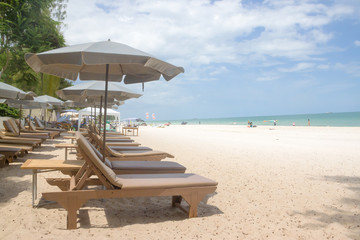 Sunbed and umbrella on a beautiful tropical beach