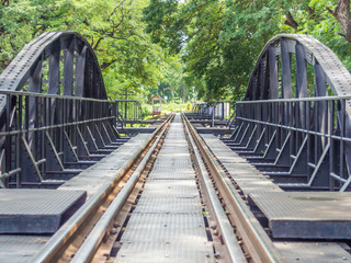 Closeup of an old railway track on steel bridge