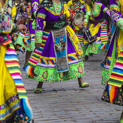 Naklejka premium Peruvian dancers at the parade in Cusco. People in traditional clothes.
