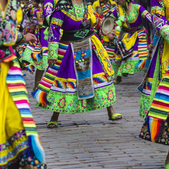 Fototapeta na wymiar Peruvian dancers at the parade in Cusco. People in traditional clothes.