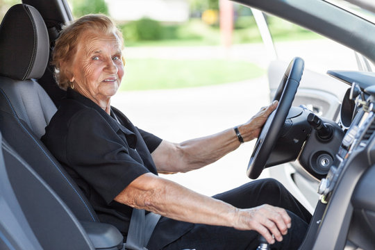 Elderly woman behind the steering wheel