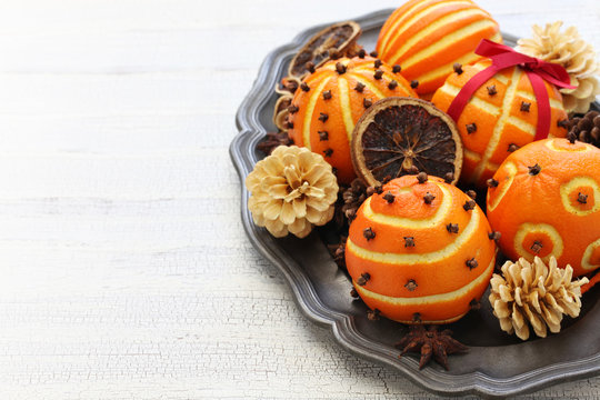 spiced orange pomander balls, scented christmas table decoration