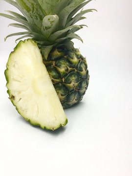 ripe whole pineapple isolated on white background