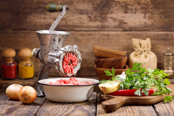 old grinder with minced meat