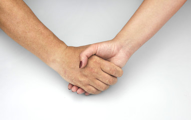 hands of man and woman caught together
