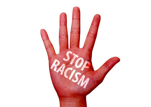 stop racism written on a hand