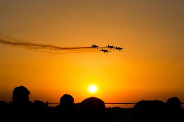 Fototapeta na wymiar Airshow planes at sunset