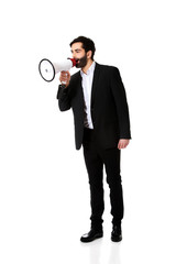 Fototapeta premium Businessman shouting using a megaphone.