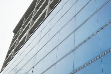 Fototapeta na wymiar Detail of blue glass facade of a contemporary building