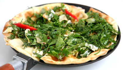 Thin armenian pita bread with cheese, pepper and herbs