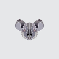 Obraz premium Koala colored head. Geometric logo polygonal silhouette isolated on grey background. Design element illustration.