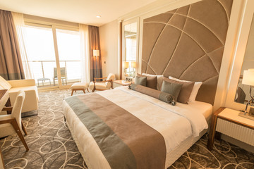 Modern hotel room with big bed