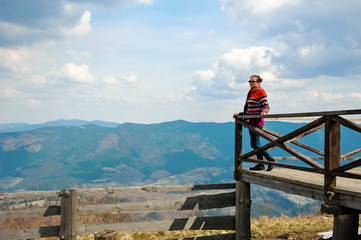 Fototapeta na wymiar Sporty girl in the Carpathians.The outdoor Seating. 