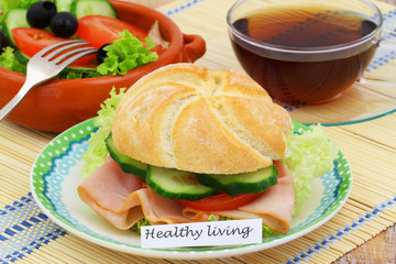 Healthy living card with sandwich and bowl of salad
