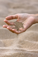 sand running through hand